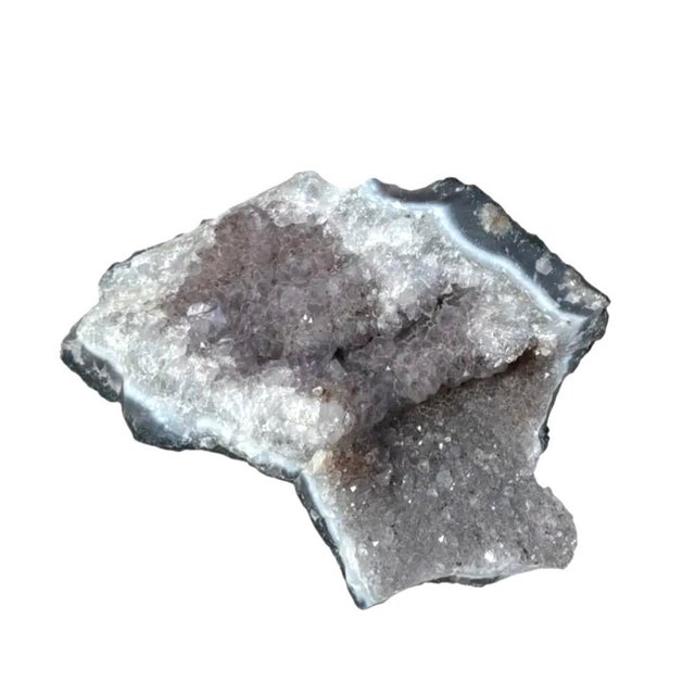 Natural Amethyst Stalactite Geode Crystal Specimen. featuring a glittering interior of delicate lavender to soft violet...