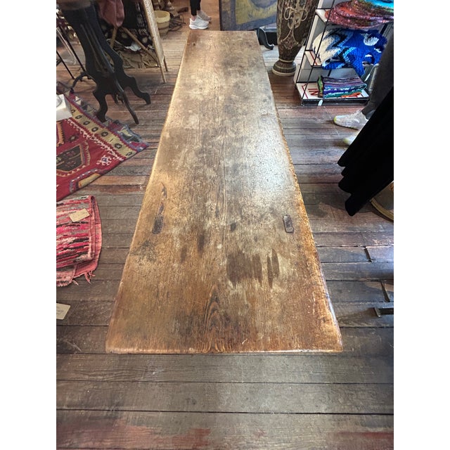 Large sturdy hand made rustic bench, probably of elm, with fabulous aged patina and peg construction. Roomy enough to use...