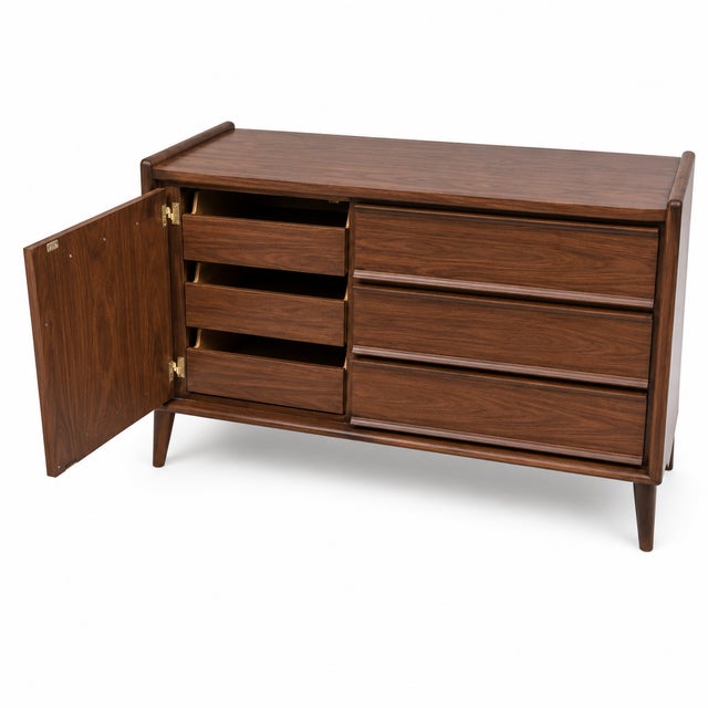 Mid century modern dresser. Dresser is well made . Circa 1960. We had dresser refinished by our shop Dresser has a unique...
