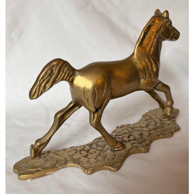Mid-Century brass horse figurine running on cobblestone. A deep patina and heavy. Label is marked “Made in Taiwan R O C,”...