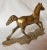 Mid-Century brass horse figurine running on cobblestone. A deep patina and heavy. Label is marked “Made in Taiwan R O C,”...