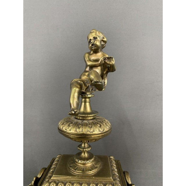 A splendid bronze fireplace set dating from the early 20th century, this exceptional piece combines elegance and history....