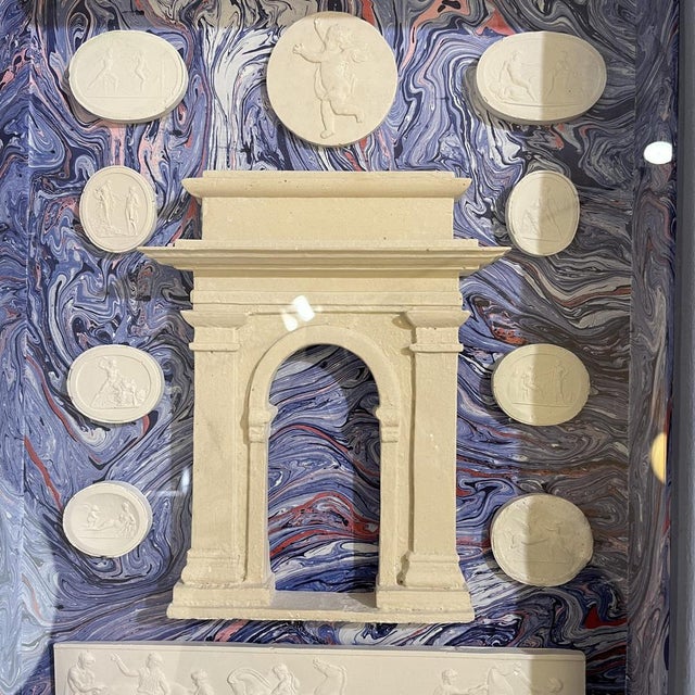 Elegant painting that presents relief figures of plaster, made with the intaglio technique, on a wallpaper background with...