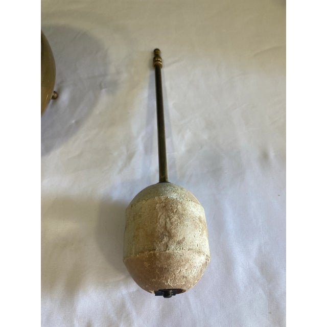 a very nice solid brass fire starting pot. The pot has a lid and brass handled pumice stick. Tripod legs make this pretty...