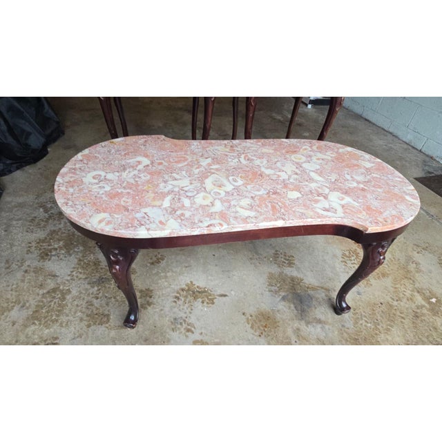 Mahogany carved wood base and beautiful, rare, pink rose marble top in excellent condition! It appears to have a very...