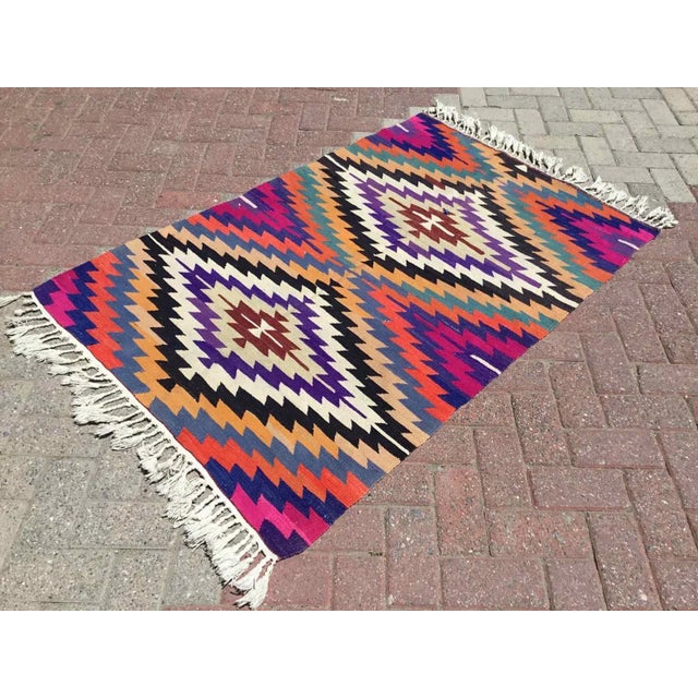 This beautiful, vintage, handwoven kilim is approximately 60 years old. It is handmade of very fine quality, hand-spun...