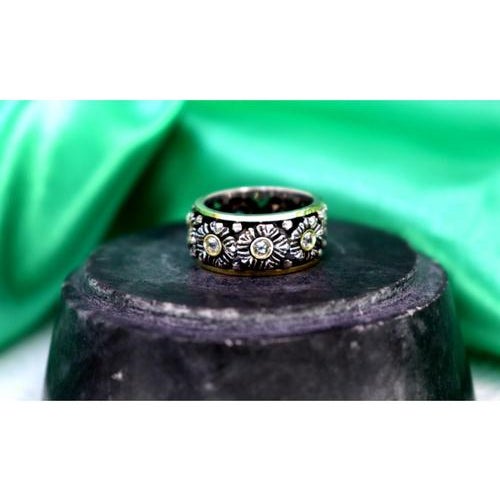 Gold and Silver Ring with Flower-Shaped Reliefs, in Very Good conditions. Designed 1980 to 1989 This piece has an...
