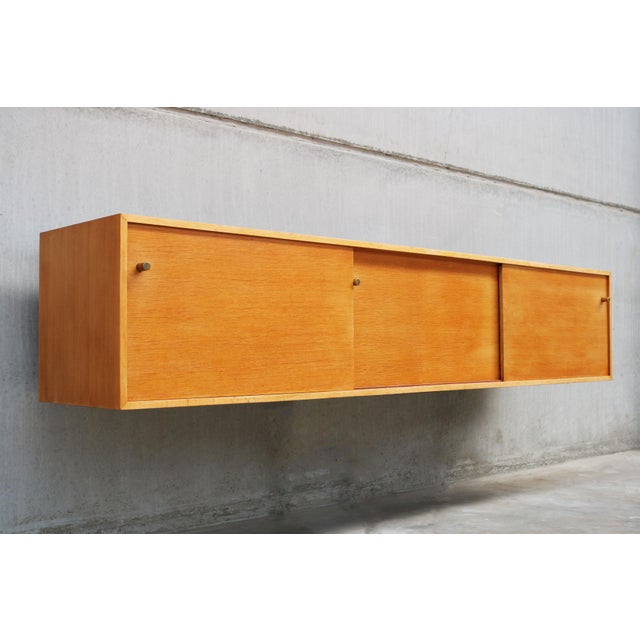 Timeless Elegance: Floating Oak Sideboard model: Abstracta by Jos De Mey for Van Den Berghe-Pauvers 1960. Discover the...
