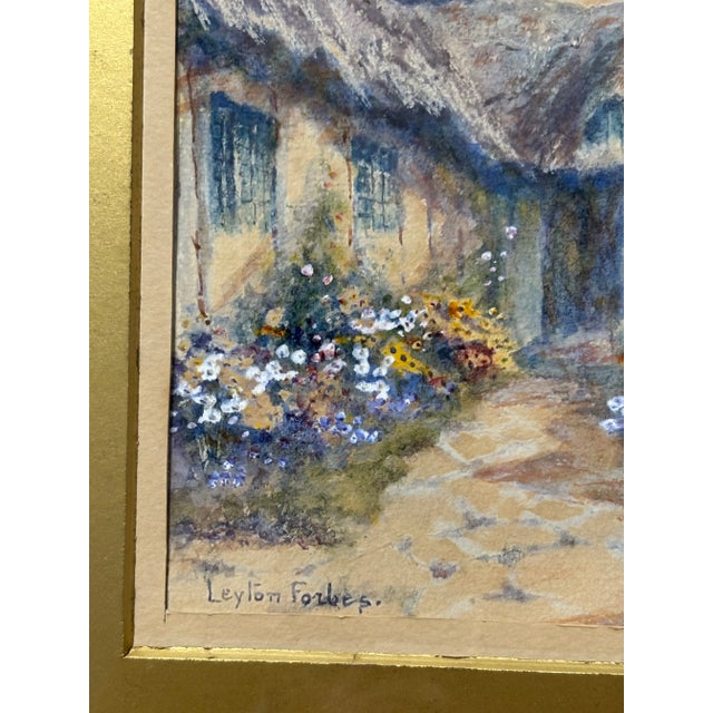 An original framed watercolor by English artist Leyton Forbes, entitled “A Cornish Garden.” The work is rendered in a...