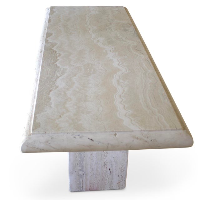 Stunning travertine console table with the most beautiful and striking pattern on the top surface. The pattern contains...