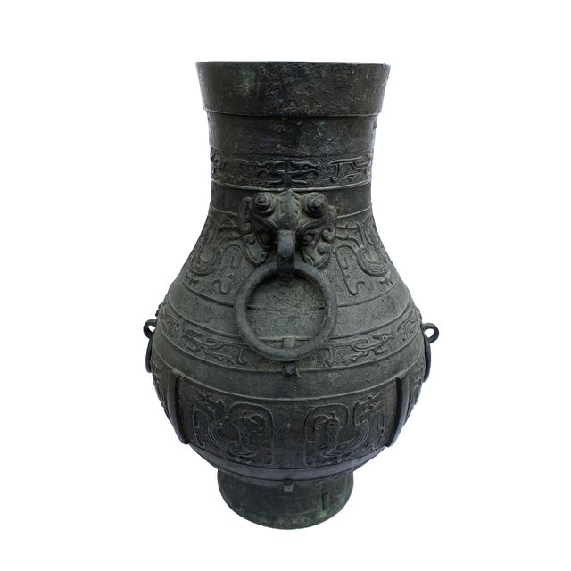 Fabulous, hand-crafted antique black bronze vessel with dragons, birds and other classical Asian motif reliefs and...