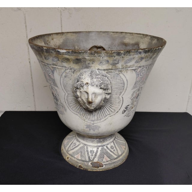Antique Enameled Cast Iron Urn. It is 15.5" high x 15.5" wide and deep without including the faces. Paris et Cie 19th...