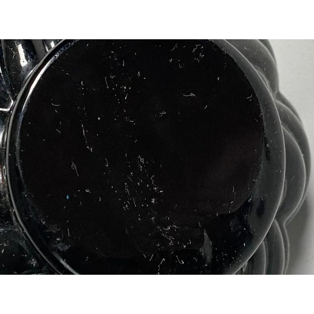 Small bottle or decorative vase in glass. It has been made in Italy circa 1960.