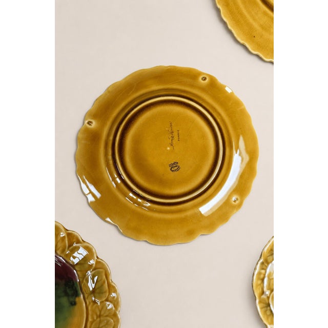An exceptional and highly collectible complete set of twelve antique French majolica, also known as barbotine, fruit...