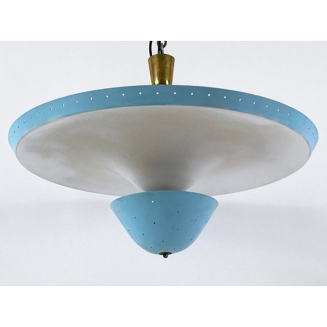 Extremely rare, large and highly decorative mid-century modern four-flamed ceiling lamp or pendant light. Designed and...
