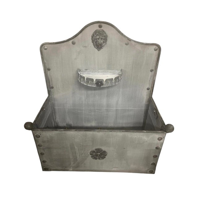 impressive wall-mounted fountain and planter. Crafted from sturdy steel with a weathered zinc finish, this piece captures...