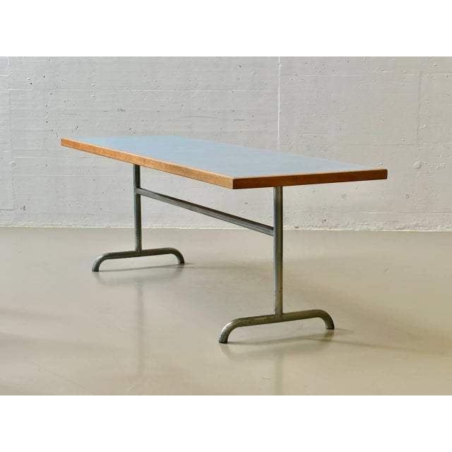 This exceptional table from the long-established swiss manufacturer horgenglarus exemplifies functional furniture design...