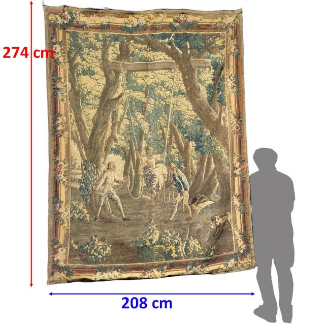 An important 18th-century wool tapestry, likely from Aubusson, depicting "The Swing," one of the subjects in the famous...