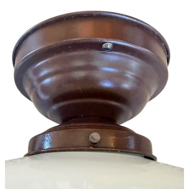 Perfect for a small entryway, bathroom or breakfast nook. Beautiful milk glass with a painted metal holder exude a soft...