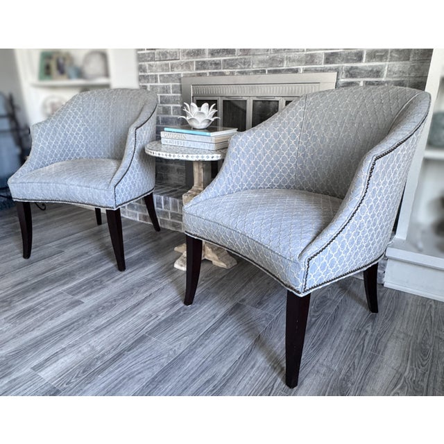 Offering a handsomely tailored and graceful silhouette—these custom beauties are upholstered in a sophisticated powder...