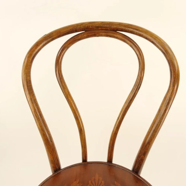 Bentwood chair from the late 19th century is in good condition. Elaborate decoration of the original seat. Total height:...