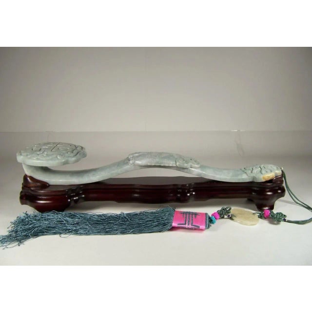 Fabulous Chinese 17" long jadeite ruyi scepter featuring a double fish. This scepter is carved from a solid piece of...