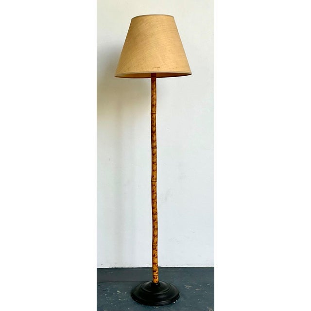 This vintage bamboo floor lamp is a striking example of mid-20th century design rooted in natural materials and relaxed...