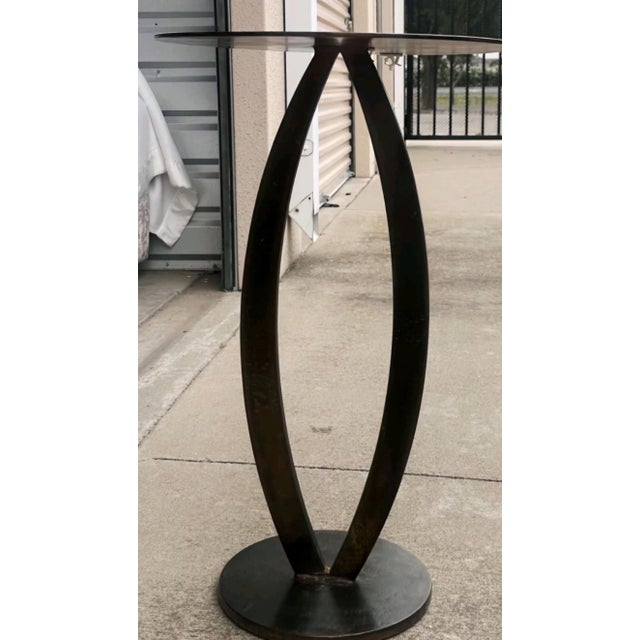 This striking side table is a masterful example of functional sculpture by renowned Berkeley-based artist Eric Powell....