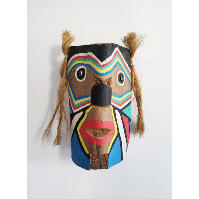 Expressive, bold, joyful Brazilian colonial art mask / wall decor, hand carved from coconut wood and hand painted in...