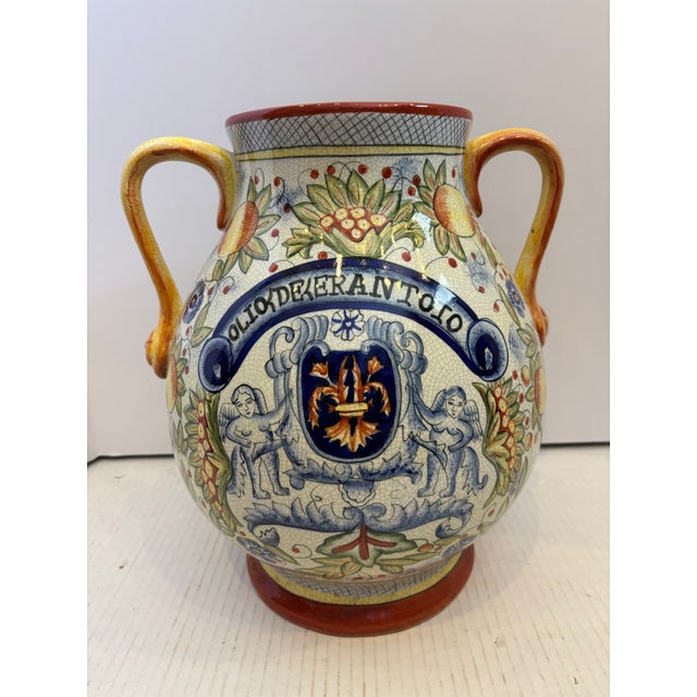 19TH Century Italian Majolica olive oil jar features hand-painted neoclassical motifs anheradic crest. The banner reads "...