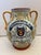 19TH Century Italian Majolica olive oil jar features hand-painted neoclassical motifs anheradic crest. The banner reads "...