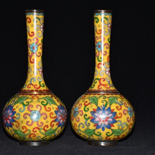 This is a beautiful vintage pair of Chinese cloisonne enamel vases, sourced from an early collection. Each vase features a...