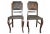 - Set of two Hungarian dining chairs - Retains its original embossed brown leather upholstery - Comes with a sturdy wooden...