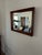 Vintage Uttermost mirror made in Rocky Top, Virginia. Beautiful thick wood frame with large beveled mirror.