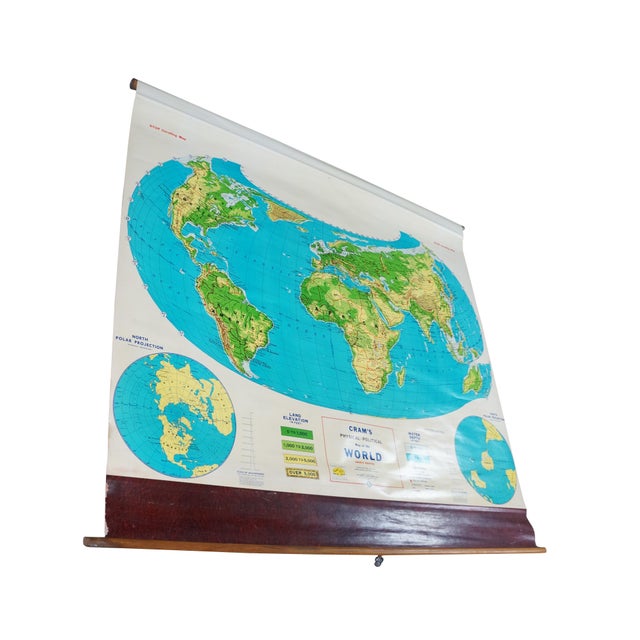 This striking vintage classroom pull-down wall map of the world was produced by the renowned George F. Cram Company....