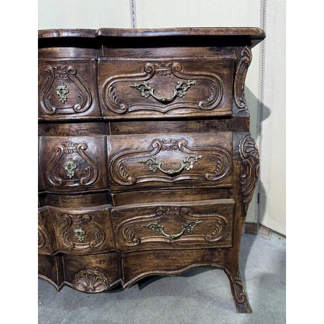 Louis XV style Provençal bombé commode in solid oak. Front opening with three drawers with gilt bronze handles. Wooden top...