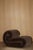 The riccio armchair stands out for its soft, enveloping design, defined by rounded shapes that evoke a cushion folded onto...