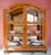 Elegant display case from the Biedermeier period with harmonious proportions, a gracefully shaped upper cornice and...