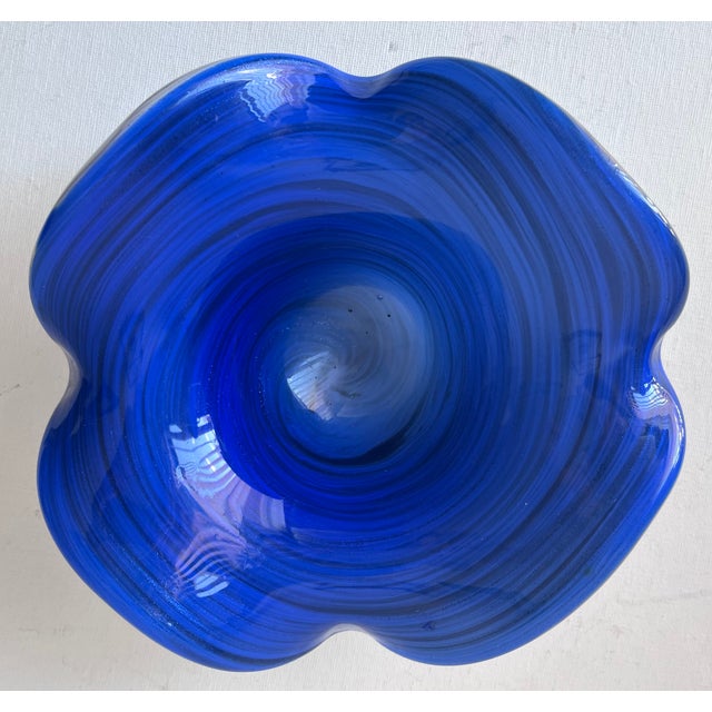 This lovely hand-blown glass decorative bowl was made in Italy on the island of Murano and features a swirled deep Blue...