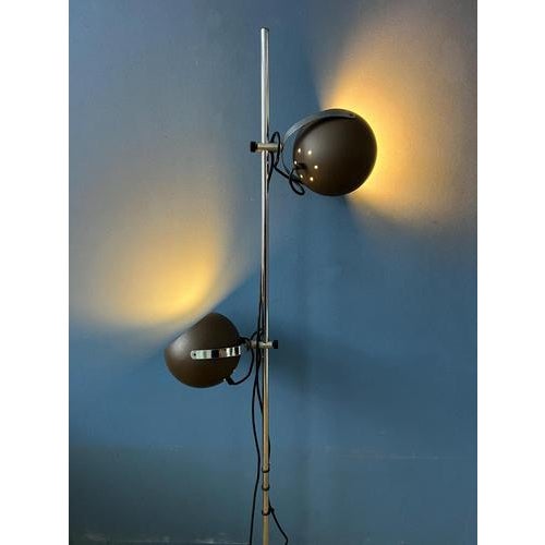 Brown space age eyeball floor lamp in mat brown colour. The adjustable "eyeball" head lets you direct the light exactly...