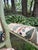 Pair of Custom Crewelwork Fauteuil Chairs in Sage Green, Ochre & Teal A pair of French-style fauteuil chairs finished in...