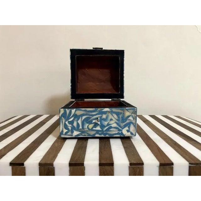 Elevate your home décor with this handcrafted wooden box, beautifully inlaid with natural , durable metal, and high-...