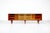 Large wooden sideboard with two sliding doors, comprising four compartments: two with shelves and two with drawers....