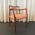 An exceptional Danish modern design classic, the Møller no. 64 captain's dining armchair in teak wood was created in the...