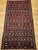 Handwoven in Morocco during the mid-1900s, this vintage kilim is a riot of geometry and color that speaks to the bold...