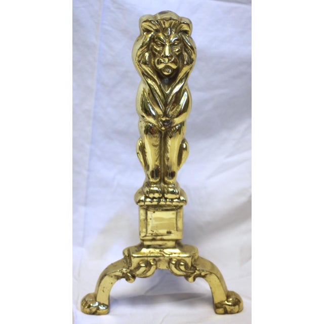 Vibrant pair of beautifully detailed, decorative brass fire irons in a lion motif that symbolizes strength, guardianship,...