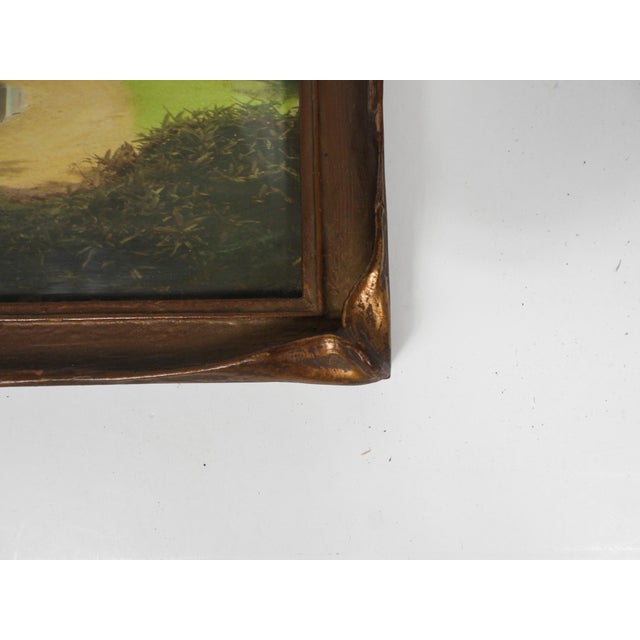 Antique early 20th century giltwood picture frame with batwing or pie crust corners. Comes with a period tinted photograph...