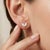 Enhance your jewellery collection with these charming leaf-inspired stud earrings featuring a graceful dual marquise...
