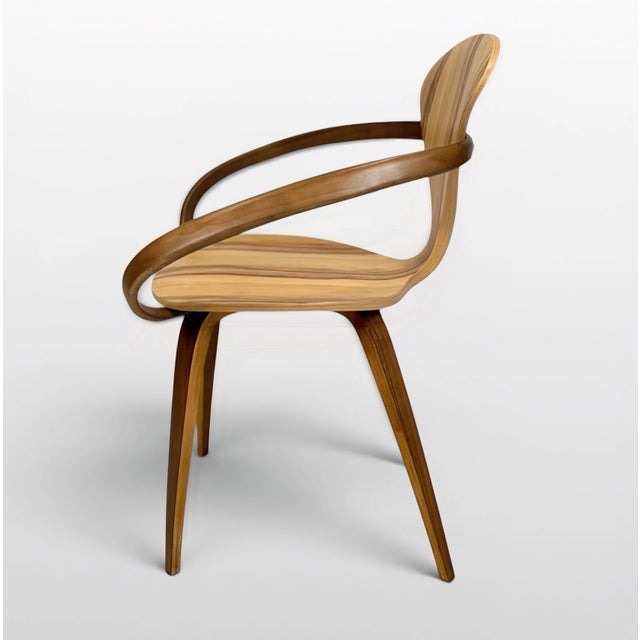 A beautifully sculptural molded plywood armchair by the Cherner Chair Company, originally designed by Norman Cherner....