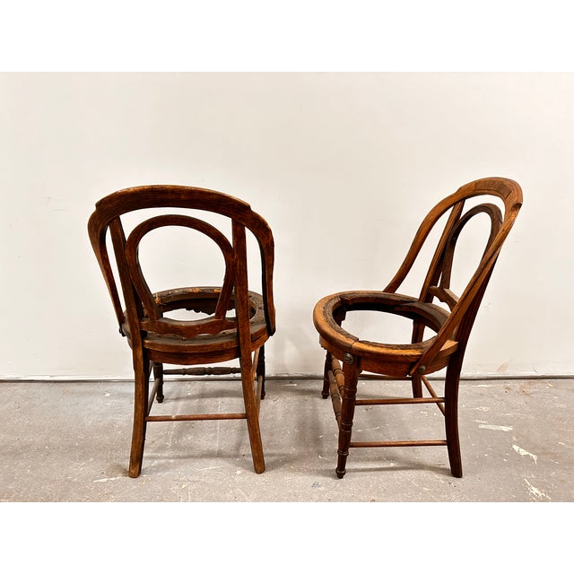This pair of very early Wakefield Brothers chair frames are made of solid oak with elaborate carving and design. They...